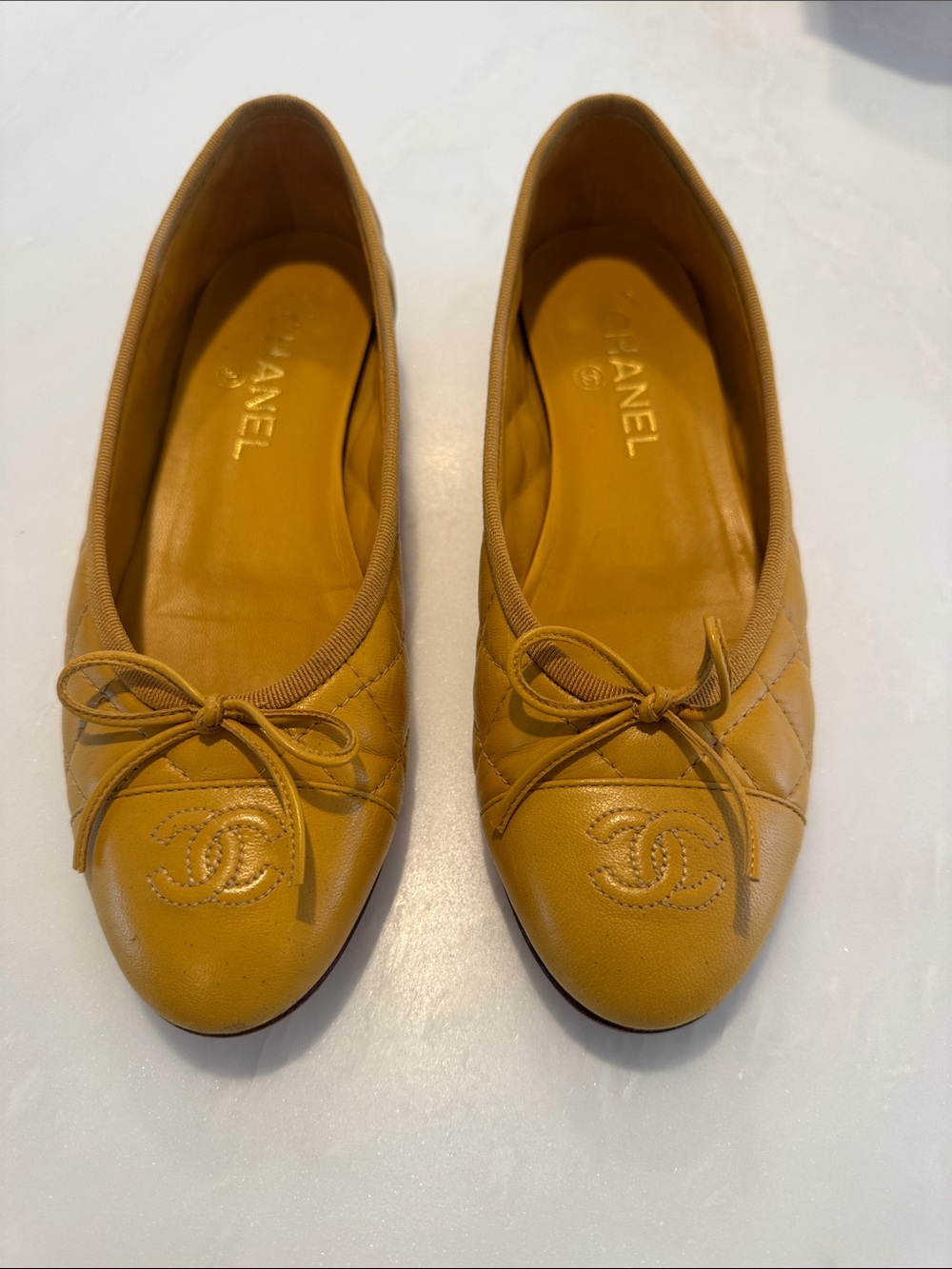 CHANEL Quilted Leather Ballet Flats in Mustard